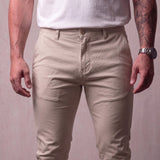 Men's Stone Slim Fit Tapered Chino Trousers, close-up of the waistband and front pocket.