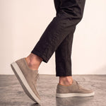 Men's Taupe Lace-Up Loafers with White Sole, the shoes in mid-step, showing the sole.