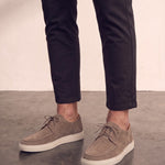 Men's Taupe Lace-Up Loafers with White Sole, three-quarter front view of the shoes, worn.