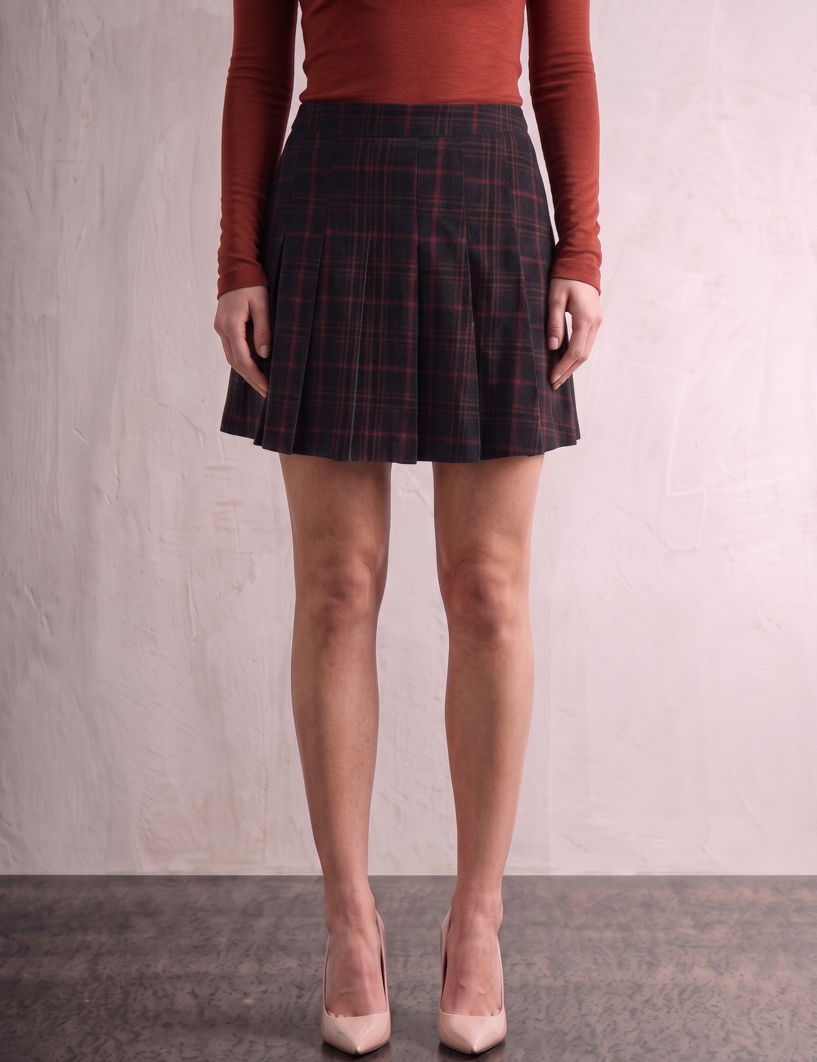 Women's Black and Red Tartan High Waisted Pleated Mini Skirt, front view from the waist down.