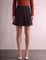Women's Black and Red Tartan High Waisted Pleated Mini Skirt, front view from the waist down.