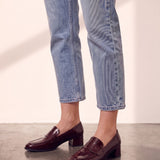 Women's Burgundy Patent Block Heel Loafers, side view of the shoe, worn.