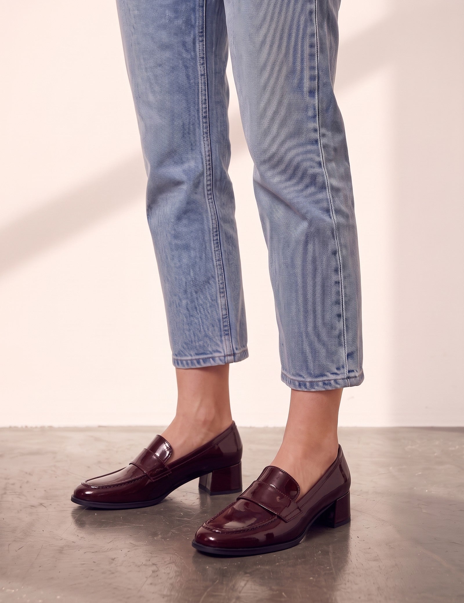 Women's Burgundy Patent Block Heel Loafers, side view of the shoe, worn.