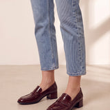 Women's Burgundy Patent Block Heel Loafers, three-quarter front view of the shoes, worn.