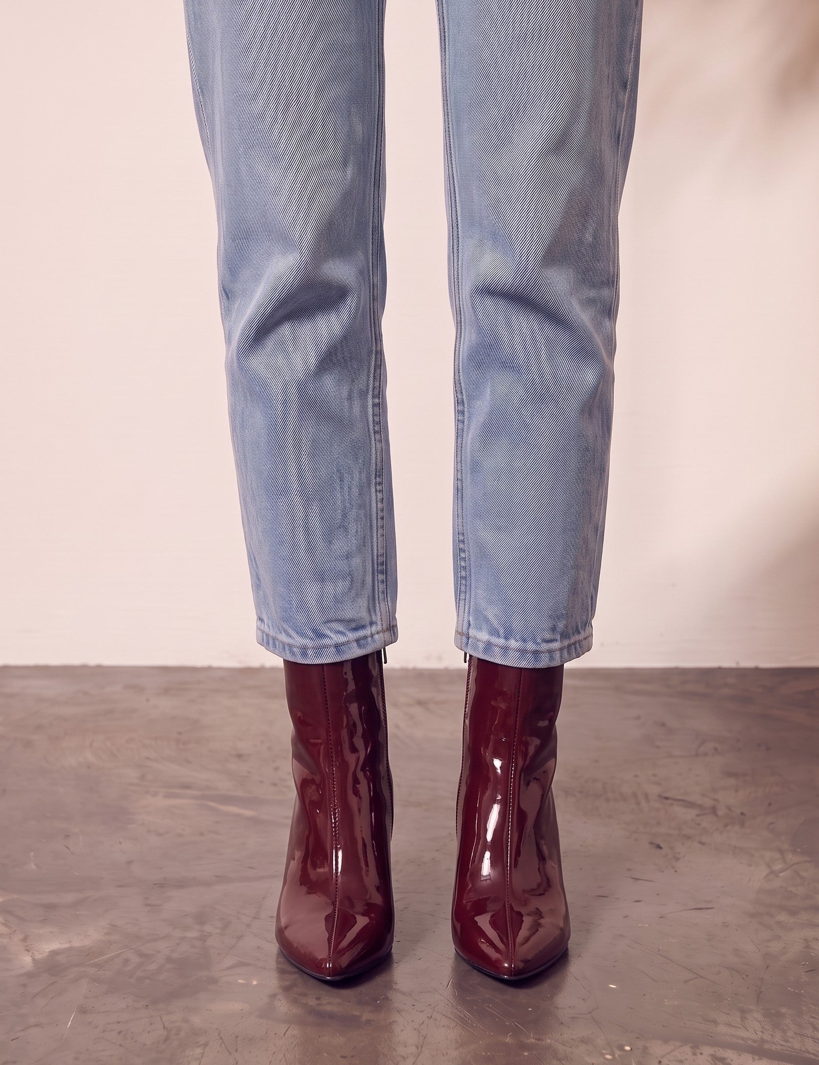Women's Burgundy Patent Pointed Block Heel Ankle Boots, front view of the shoes, worn.