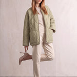 Women's Sage Green Quilted Collarless Jacket with Pockets, three-quarter view from the left, full length.