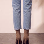 Women's Taupe Ribbed Knit Stiletto Sock Boots, back view of the heels, worn.