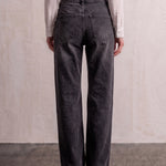 Women's Washed Black High Waisted Wide Leg Jeans, back view from the waist down.