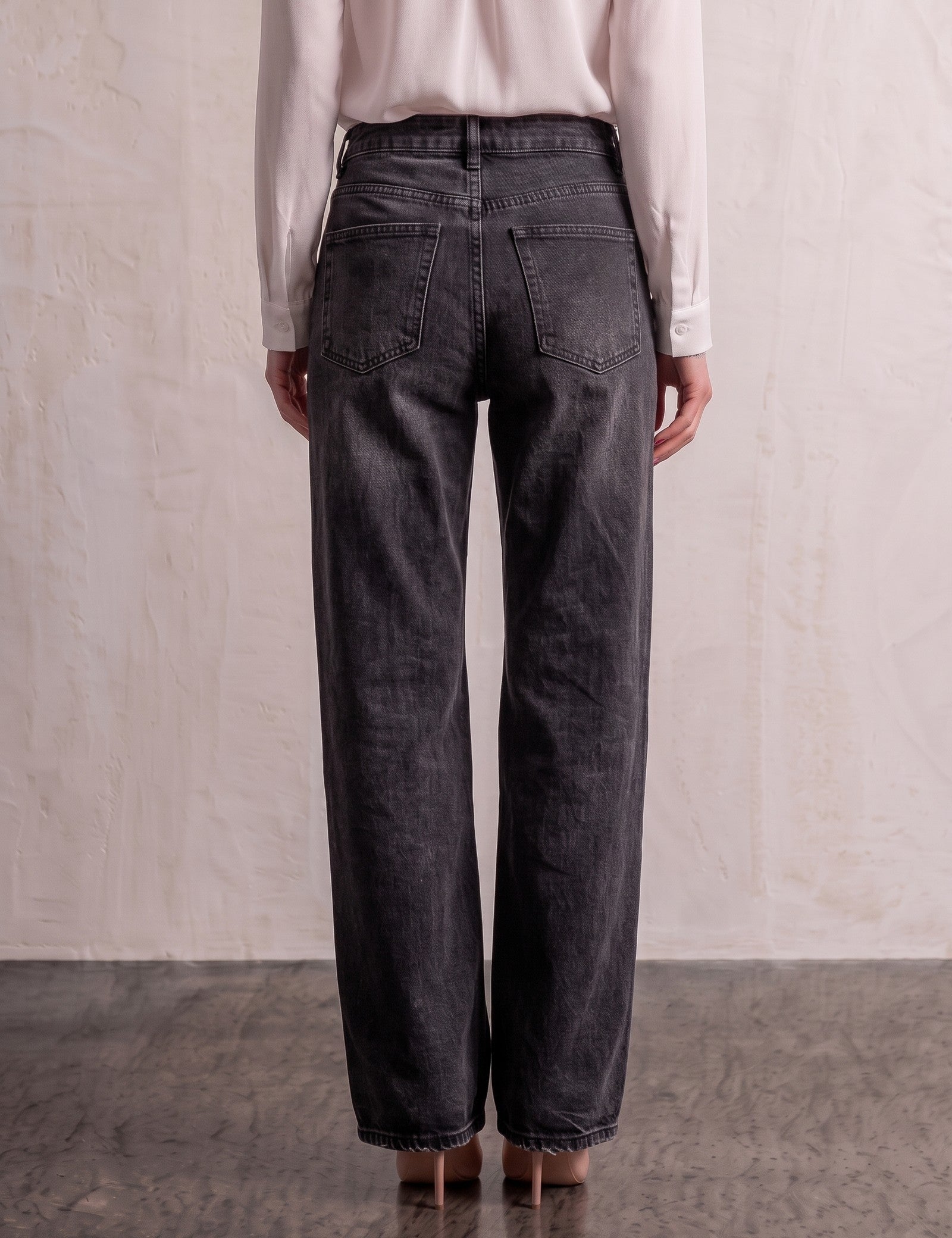 Women's Washed Black High Waisted Wide Leg Jeans, back view from the waist down.