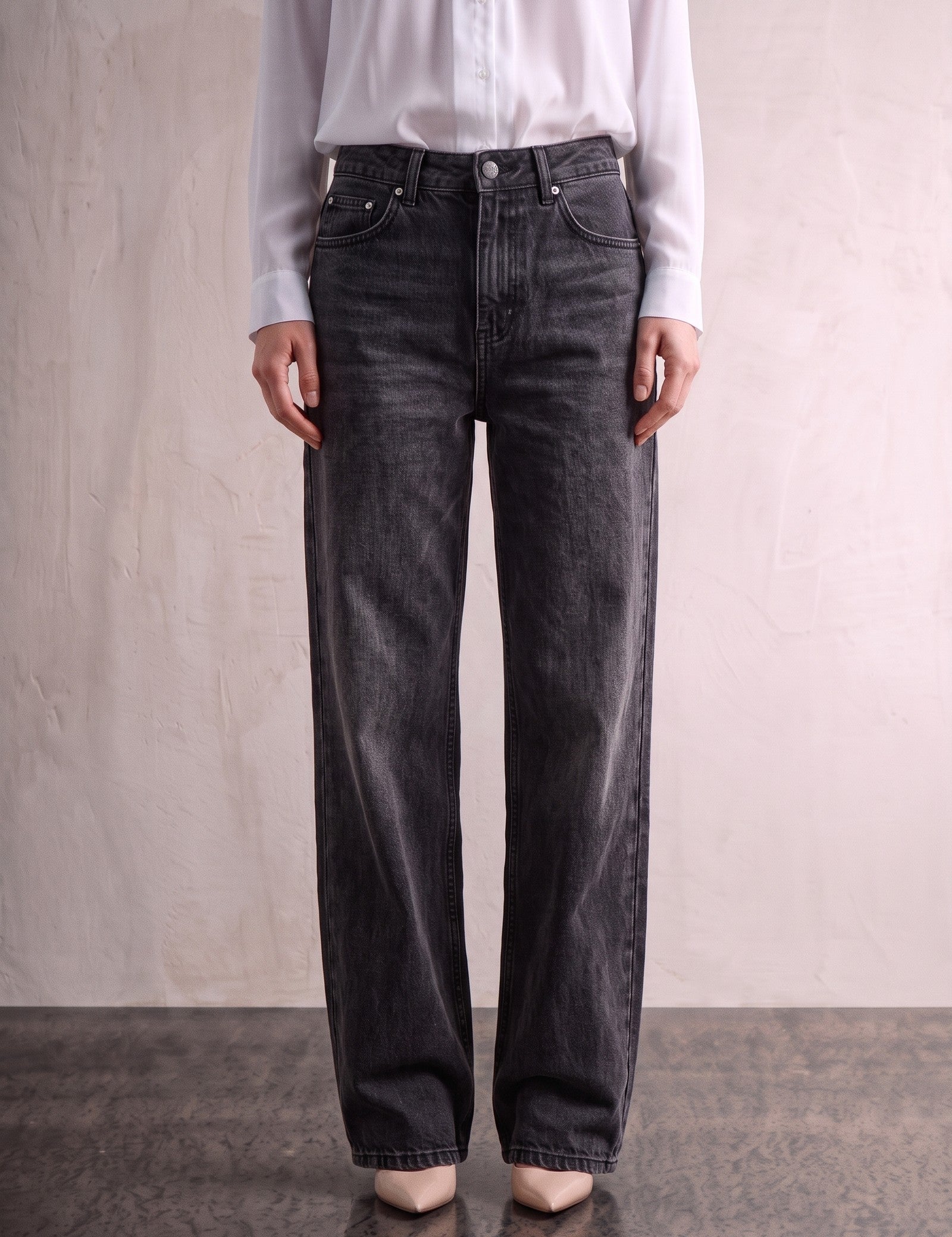 Women's Washed Black High Waisted Wide Leg Jeans, front view from the waist down.