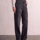 Women's Washed Black High Waisted Wide Leg Jeans, three-quarter view from the waist down.
