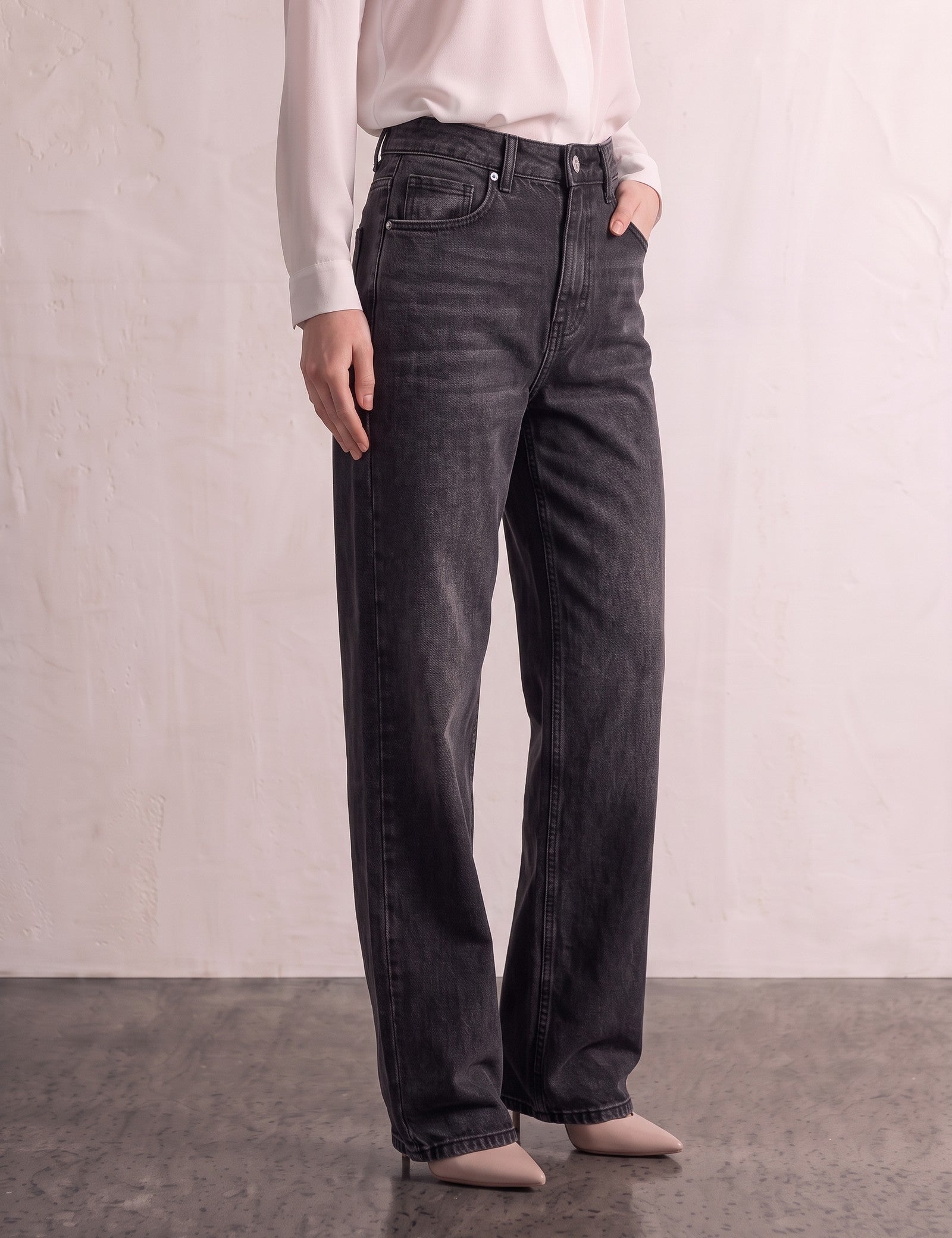 Women's Washed Black High Waisted Wide Leg Jeans, three-quarter view from the waist down.