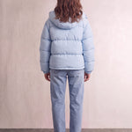 Women's Baby Blue Hooded Puffer Jacket with Pockets, back view, full length.