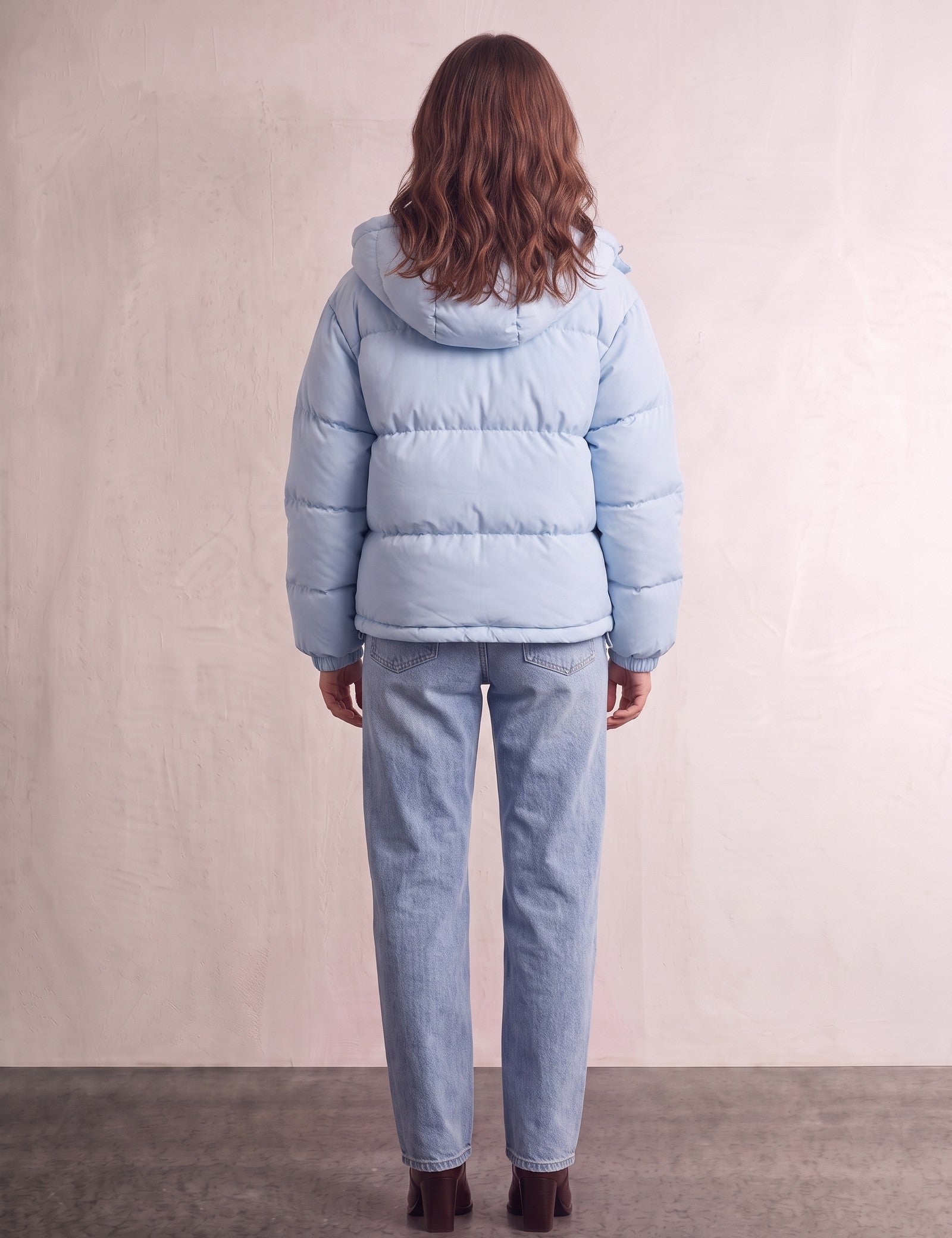 Women's Baby Blue Hooded Puffer Jacket with Pockets, back view, full length.