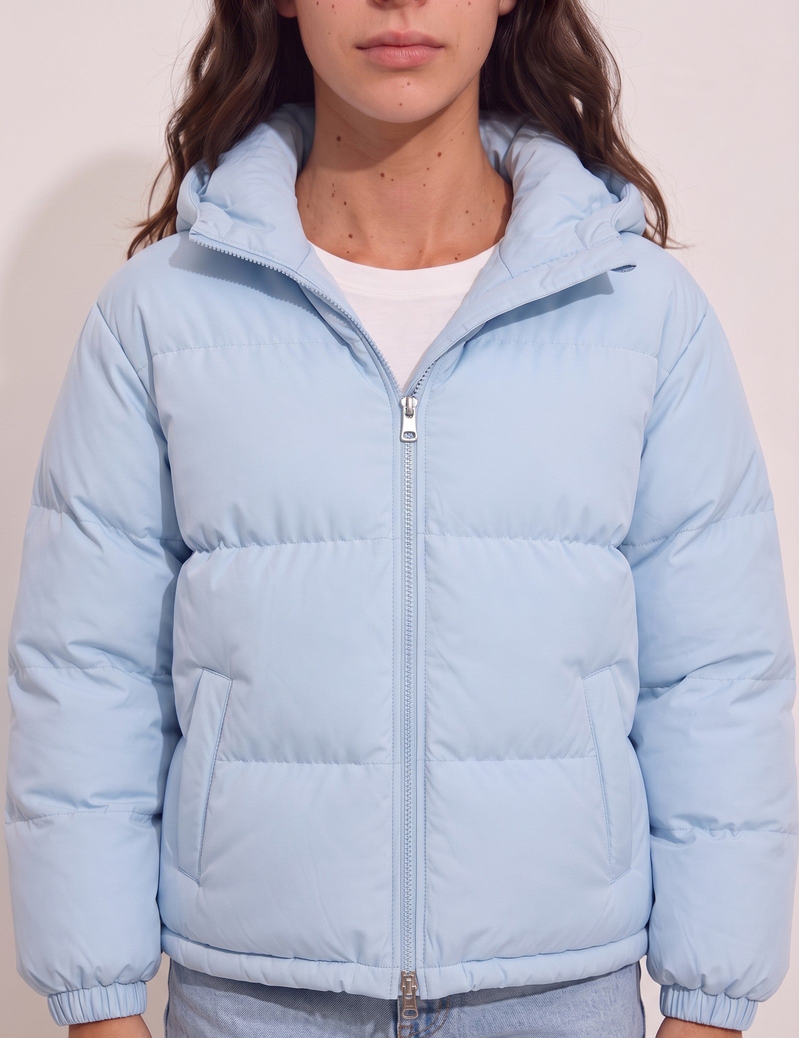 Women's Baby Blue Hooded Puffer Jacket with Pockets, close-up of the upper body.