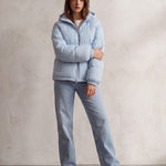Women's Baby Blue Hooded Puffer Jacket with Pockets, front view, full length.