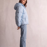 Women's Baby Blue Hooded Puffer Jacket with Pockets, side view, full length.