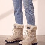 Women's Beige Faux Fur Lined Lace-Up Winter Boots, side view of the shoe, worn.
