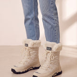Women's Beige Faux Fur Lined Lace-Up Winter Boots, three-quarter front view of the shoes, worn.