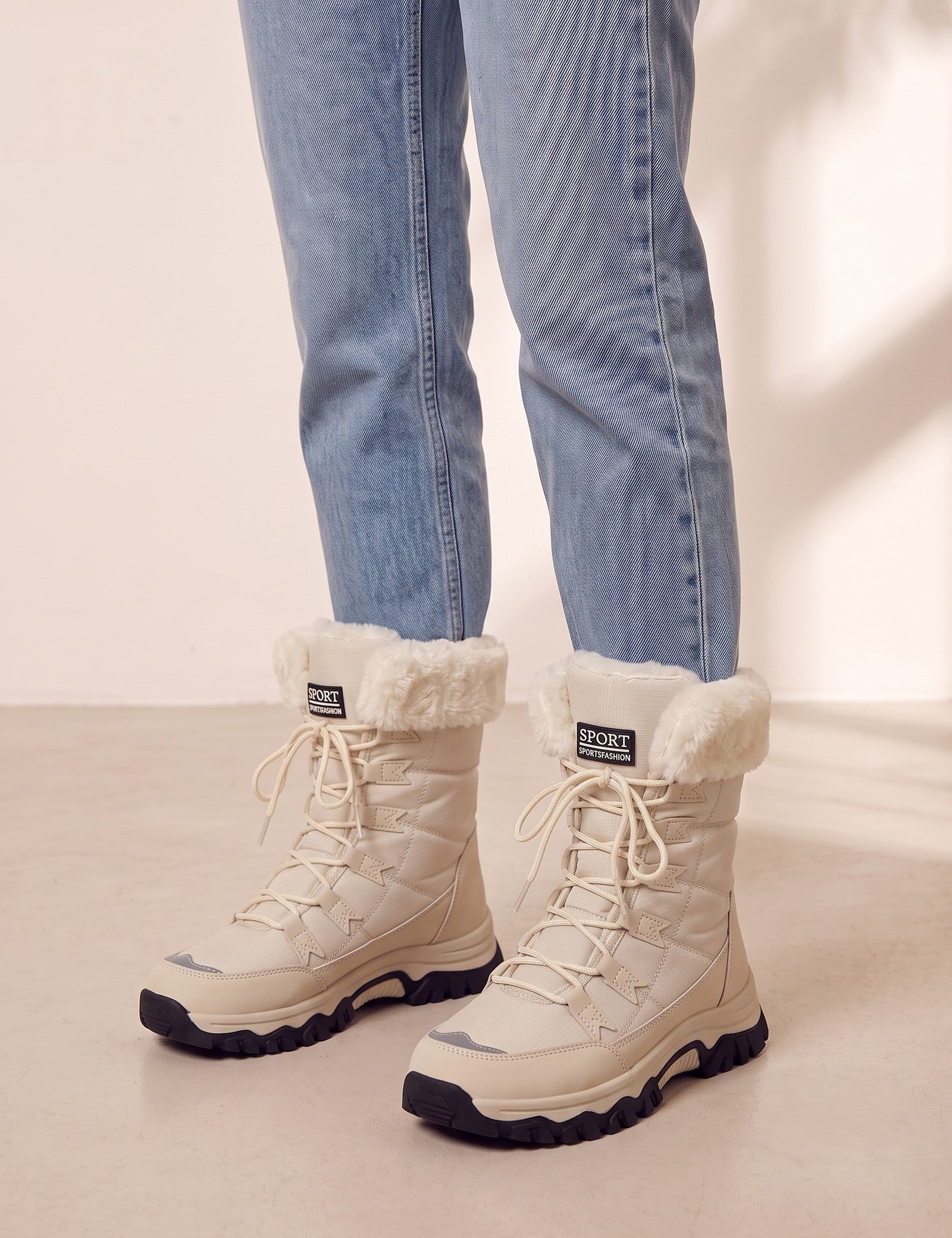 Women's Beige Faux Fur Lined Lace-Up Winter Boots, three-quarter front view of the shoes, worn.