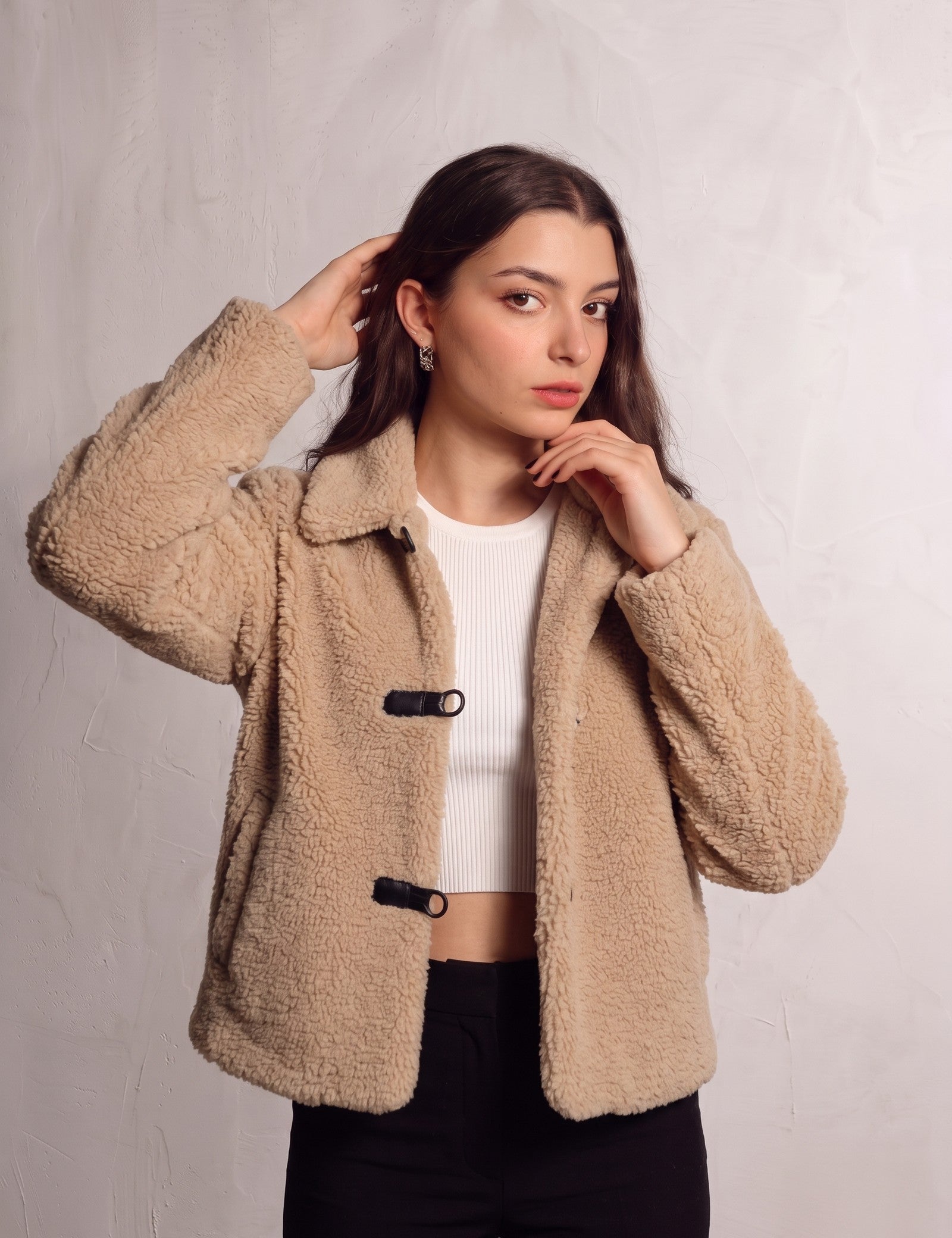 Women's Beige Teddy Jacket with Black Toggle Fastenings, close-up of the upper body.
