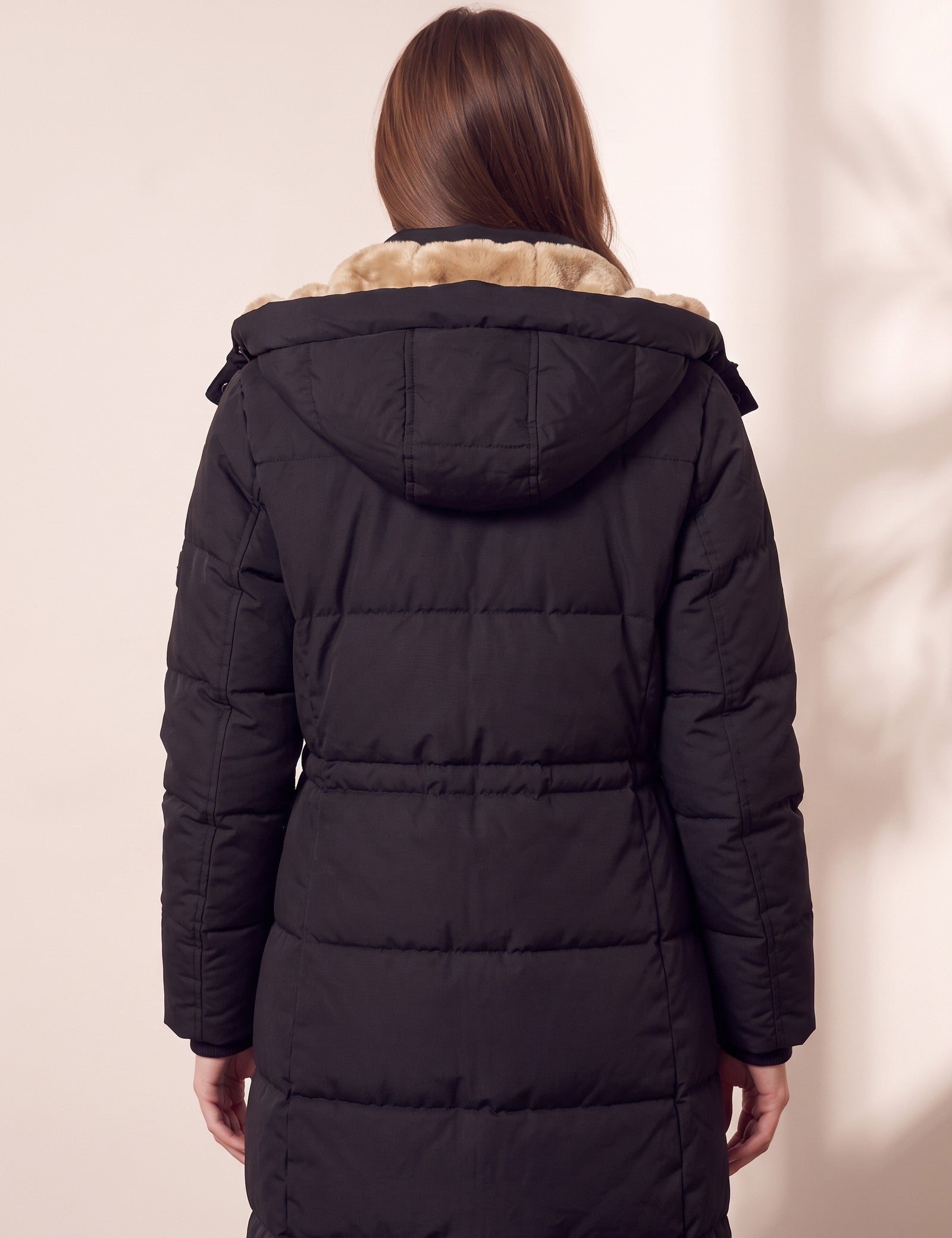 Women's Black Longline Quilted Winter Coat with Hood, close-up of the upper body.