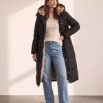 Women's Black Longline Quilted Winter Coat with Hood, side view, full length.