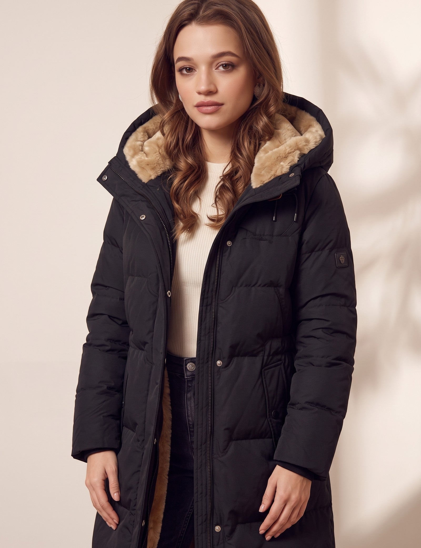 Women's Black Longline Quilted Winter Coat with Hood, three-quarter view from the left, full length.