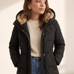 Women's Black Longline Quilted Winter Coat with Hood, three-quarter view from the right, full length.