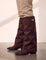 Women's Black Pointed-Toe Fold-Over Knee-High Boots - Brown, side view of the shoe, worn.