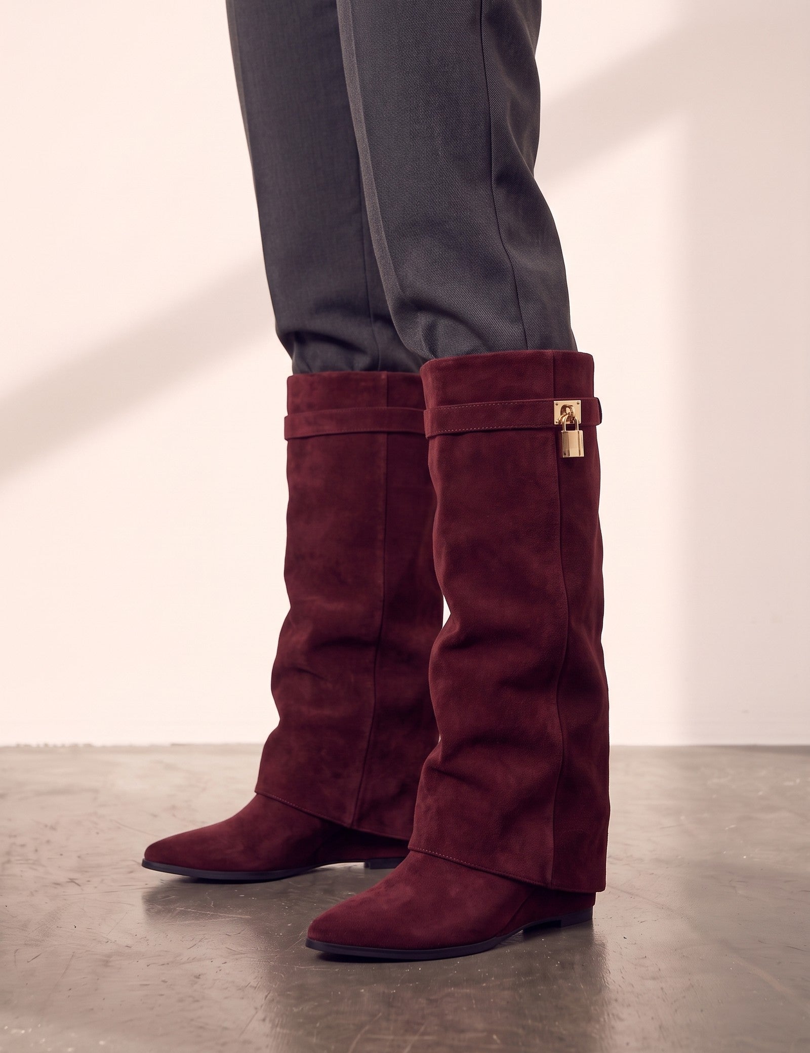 Women's Black Pointed-Toe Fold-Over Knee-High Boots - Burgundy, side view of the shoe, worn.