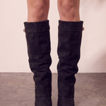Women's Black Pointed-Toe Fold-Over Knee-High Boots, front view of the shoes, worn.