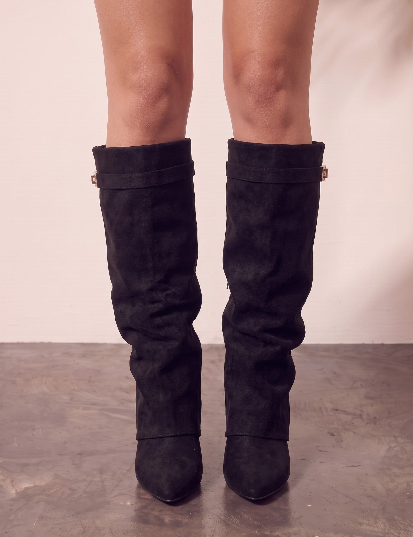 Women's Black Pointed-Toe Fold-Over Knee-High Boots, front view of the shoes, worn.