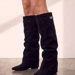 Women's Black Pointed-Toe Fold-Over Knee-High Boots, side view of the shoe, worn.