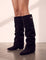 Women's Black Pointed-Toe Fold-Over Knee-High Boots, side view of the shoe, worn.
