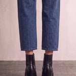 Women's Black Western Ankle Boots with Pointed Toe, back view of the heels, worn.