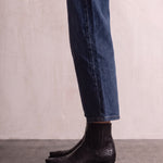 Women's Black Western Ankle Boots with Pointed Toe, side view of the shoe, worn.