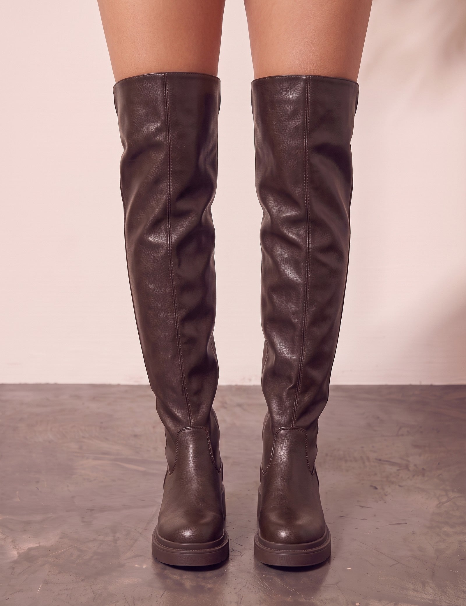 Women's Brown Leather-Look Platform Over-the-Knee Boots, front view of the shoes, worn.