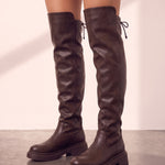 Women's Brown Leather-Look Platform Over-the-Knee Boots, side view of the shoe, worn.