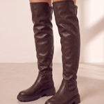 Women's Brown Leather-Look Platform Over-the-Knee Boots, three-quarter front view of the shoes, worn.