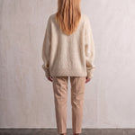 Women's Cream Relaxed Fit Roll Neck Jumper, back view, full length.