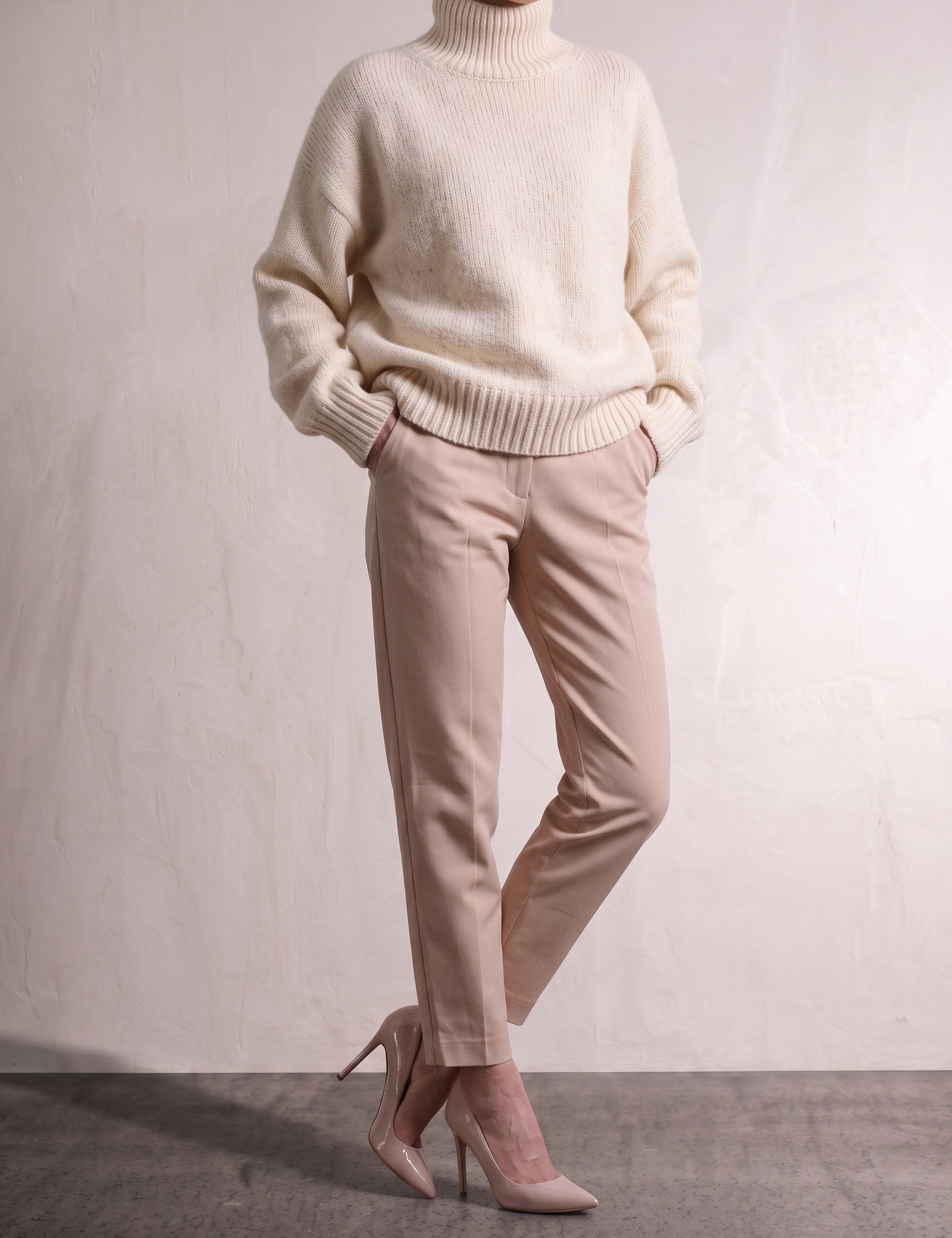 Women's Cream Relaxed Fit Roll Neck Jumper, close-up of the upper body.