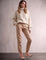 Women's Cream Relaxed Fit Roll Neck Jumper, front view, full length.