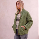 Women's Green Relaxed Fit Quilted Jacket with Pockets, three-quarter view from the right, full length.