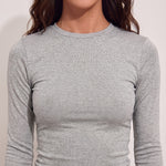 Women's Grey Long Sleeve Crop Top and Flared Trouser Set, close-up of the upper body.