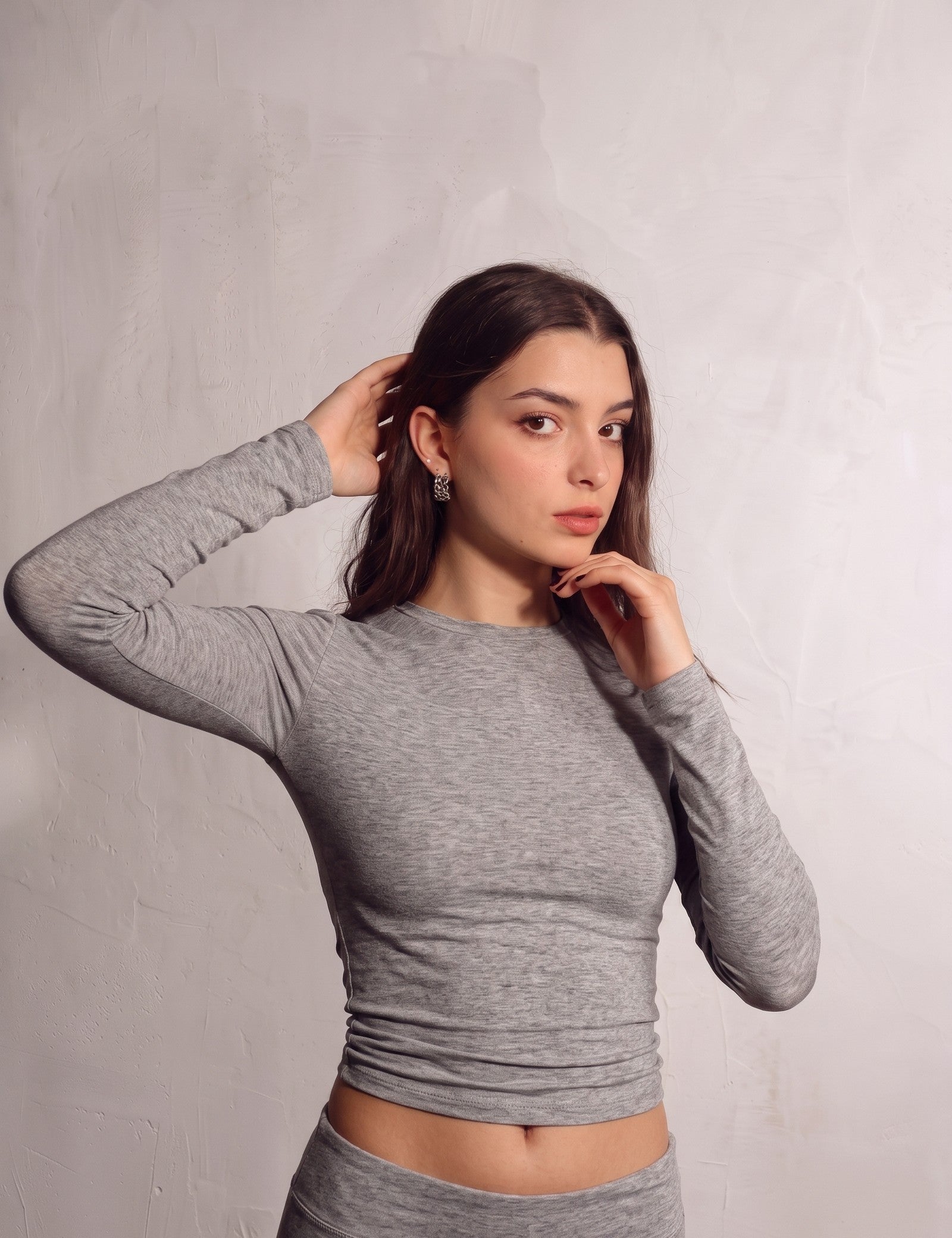 Women's Grey Long Sleeve Crop Top and Flared Trouser Set, close-up of the upper body.