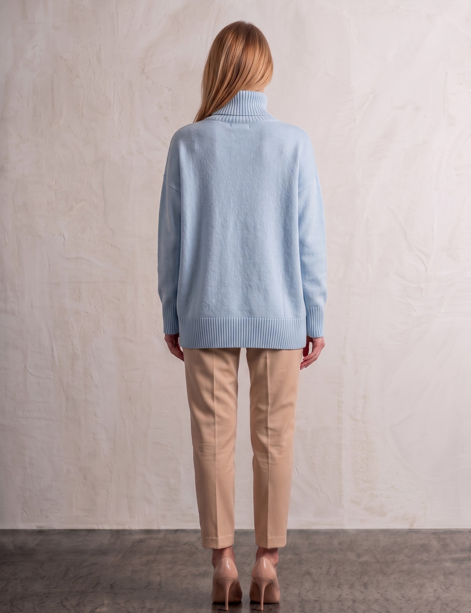 Women's Relaxed Fit Roll Neck Jumper in Light Blue, back view, full length.
