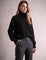 Women's Relaxed Fit Roll Neck Jumper in Black, front view, full length.