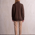 Women's Relaxed Fit Roll Neck Jumper in Brown, back view, full length.