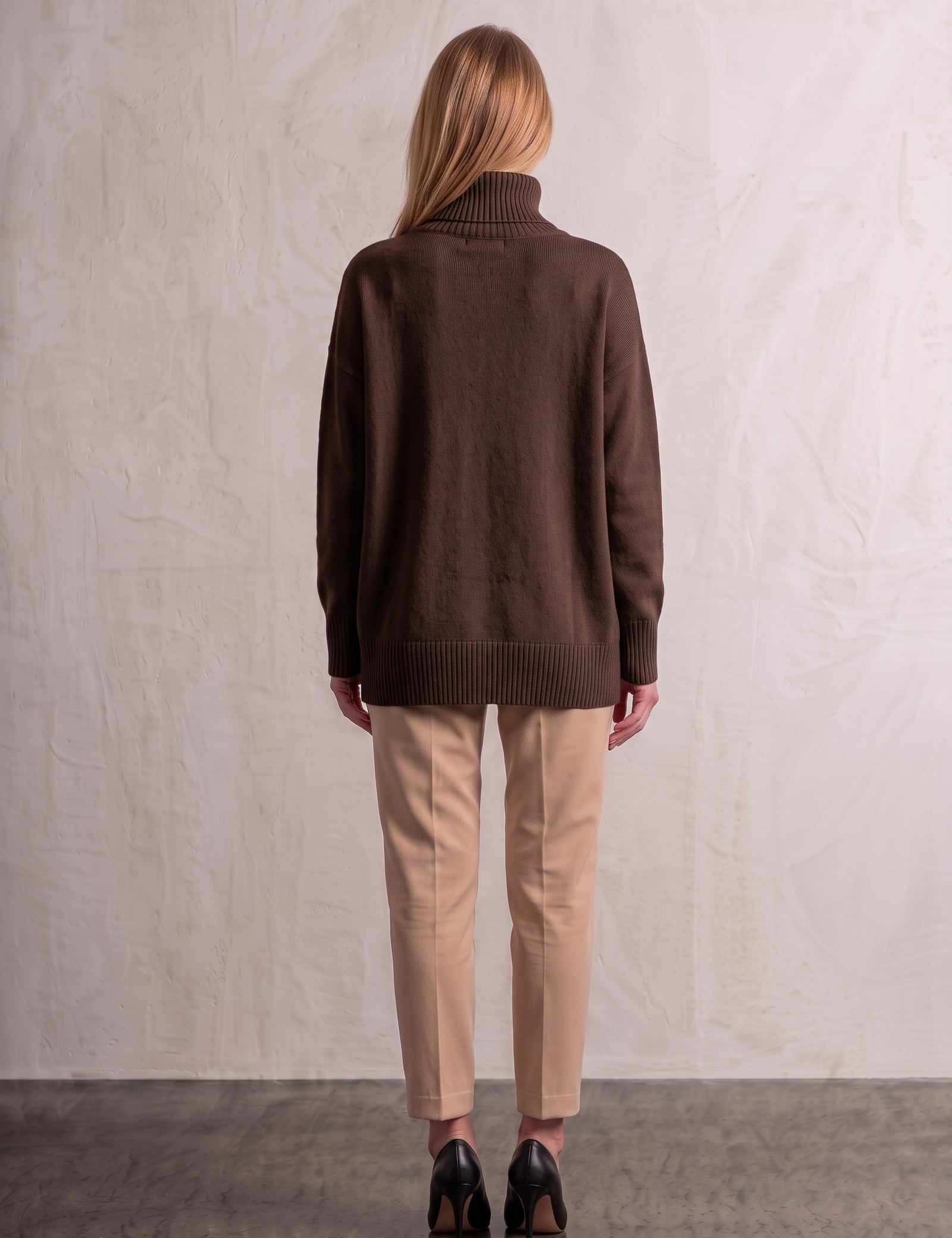 Women's Relaxed Fit Roll Neck Jumper in Brown, back view, full length.